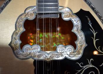 The finished bouzouki strung up and playing beautifully again