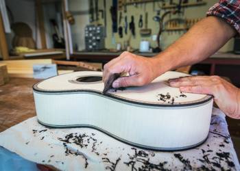 Concert Classical Guitar — ebony bindings brought to level with a sharpened hand scraper and controlled pressure.